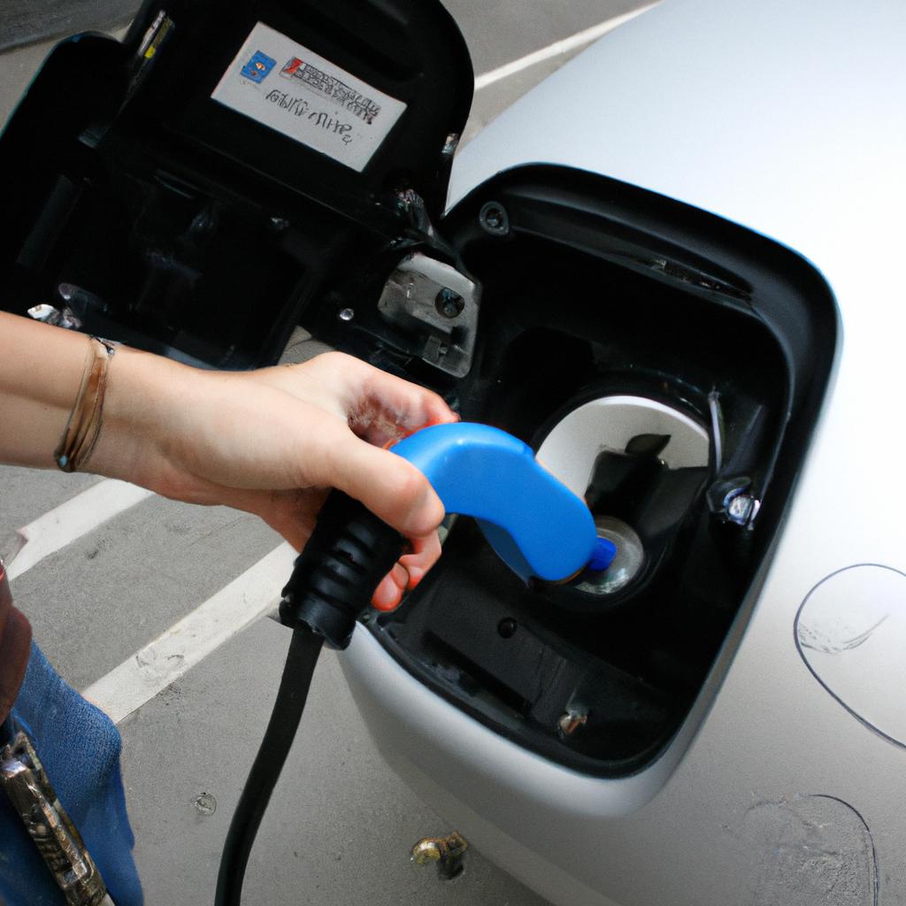 Person using electric vehicle charging